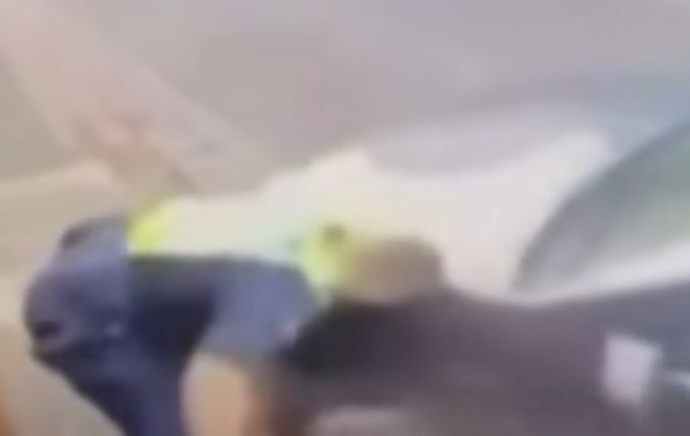 Terrifying moment screaming cop is forced to shoot woman driver dead after being left crushed against wall by stolen car