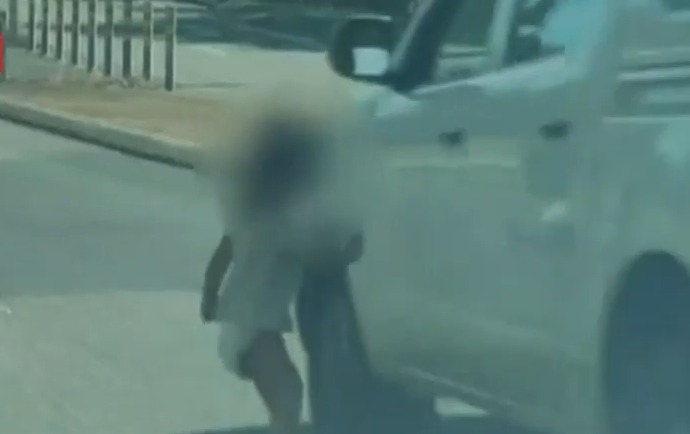 Heart-stopping moment nappy-wearing toddler dashes into dual carriageway leaving cars braking & swerving to avoid her