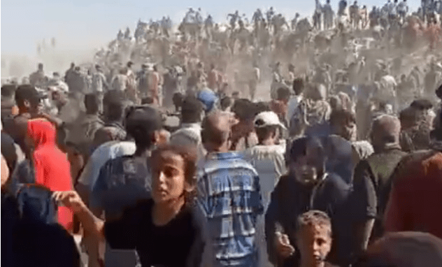 Shocking moment thousands of Gazans overrun US-backed aid site hours after it opens as ‘shots fired to disperse crowd’