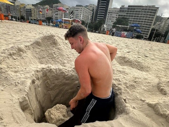 Moment Brit beachgoer is saved after being swallowed by quicksand in 8ft hole he’d dug -as he says ‘I thought I’d die’