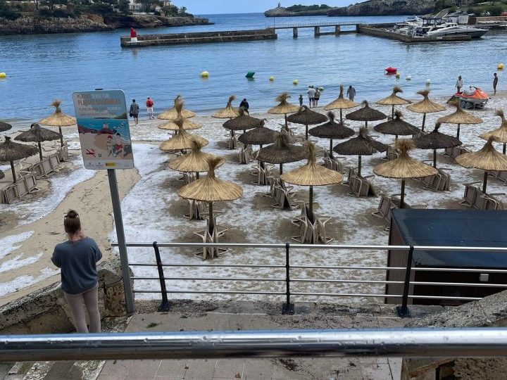 Brit hols hotspot Majorca has beaches turned white with ice and is deluged by rain & hail… with MORE bad weather on way