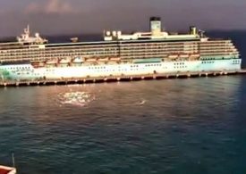 UFO zooms past cruise ship at ‘almost imperceptible speed’ in eerie video as onlookers gasp ‘what was that?!’