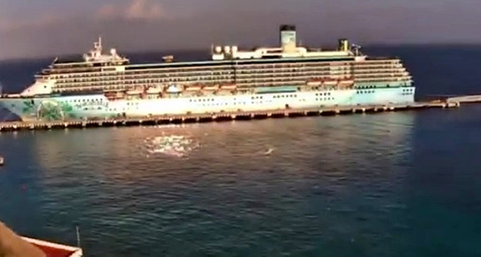 UFO zooms past cruise ship at ‘almost imperceptible speed’ in eerie video as onlookers gasp ‘what was that?!’