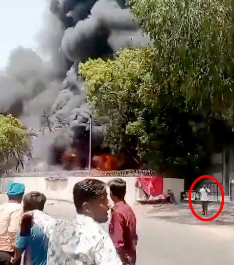 Astounding new vid shows miracle Brit survivor of Air India disaster WALK away from flaming wreck – while on the phone