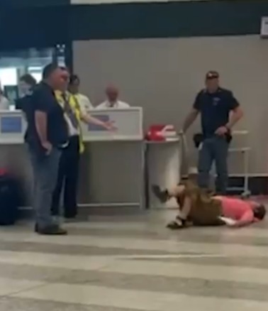 Embarrassing moment woman has shameless airport meltdown screaming & stamping feet after being told her bag was too big