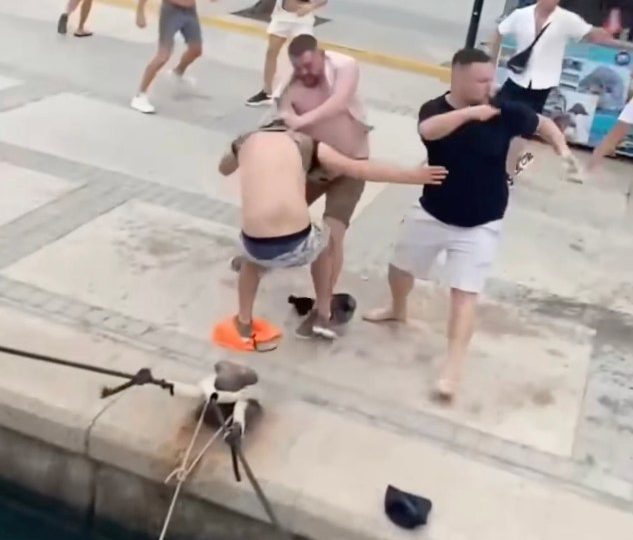 Female party boat organiser plunges into sea as mass Brit tourist brawl erupts after rowdy thugs are booted off vessel