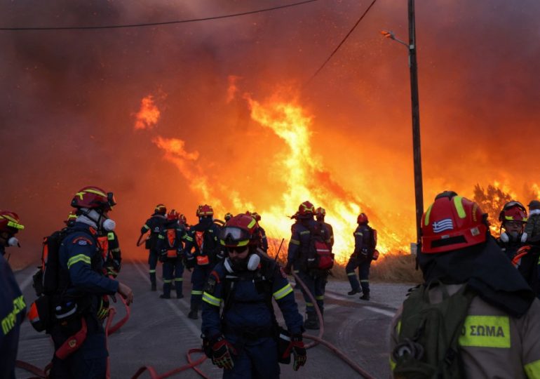 Holiday warning as wildfire is raging at Greek island forcing evacuations