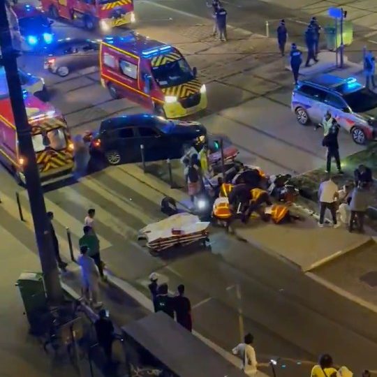 Four injured after car ploughs into crowd celebrating PSG Champions League win in Grenoble with woman fighting for life