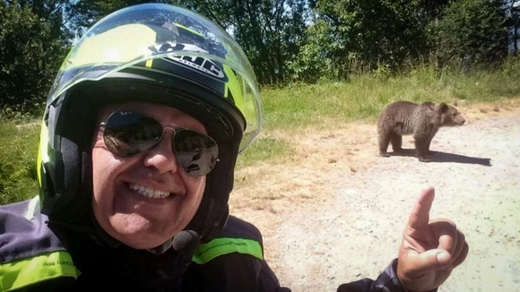 Haunting final selfie of tragic biker tourist mauled to death by brown bear after taking smiling pic and vid