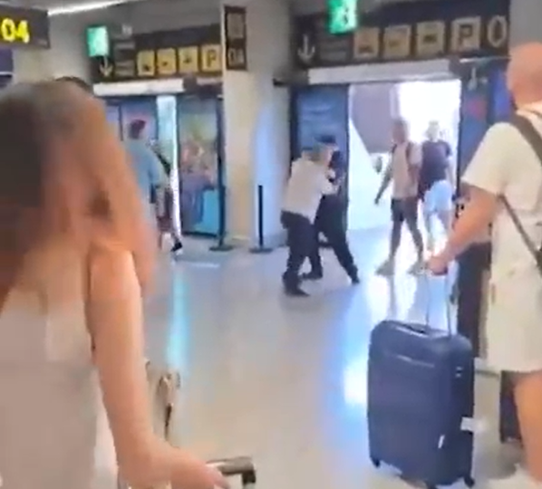 Shock vid shows minibus drivers brawling at Majorca airport in front of horrified tourists after ‘arguing over transfer’