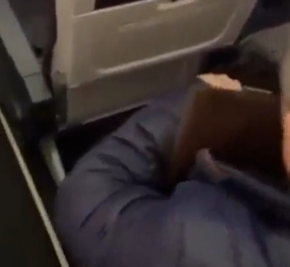 Dramatic moment furious plane passenger SLAPS ‘thief’ after watching him ‘steal from bag in overhead cabin’
