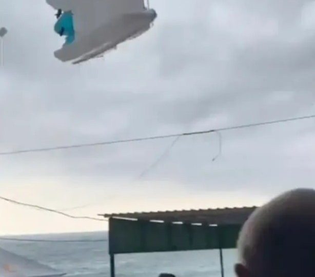 Horror moment beach pedalo hurled 50ft into air by tornado narrowly missing screaming tourists as they flee twister