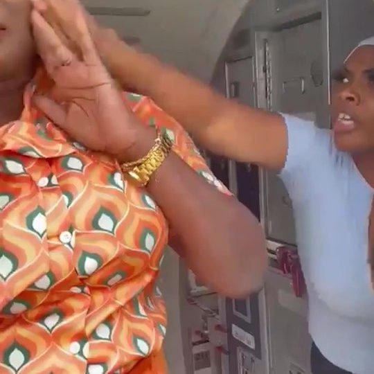 Moment plane passenger bundled screaming onto airport bus after punching stewardess & ‘refusing to turn off her phone’