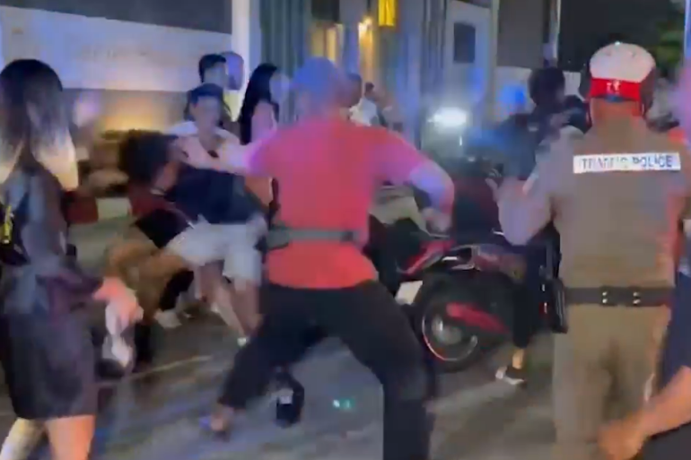 Shocking moment mob beats up Brit tourist after he ‘ploughs into woman while pulling wheelie on motorbike’ in Thailand