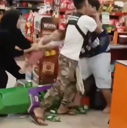 Terrifying moment knife-wielding maniac attempts to kidnap baby boy after being caught shoplifting in failed heist