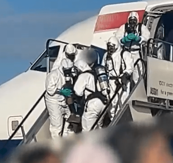 Chilling moment hazmat firefighters storm BA holiday flight after emergency landing over fears of ‘toxic leak’ on board