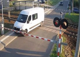 Watch moment idiot driver gets van SMASHED by train after trying to skip barriers at level crossing