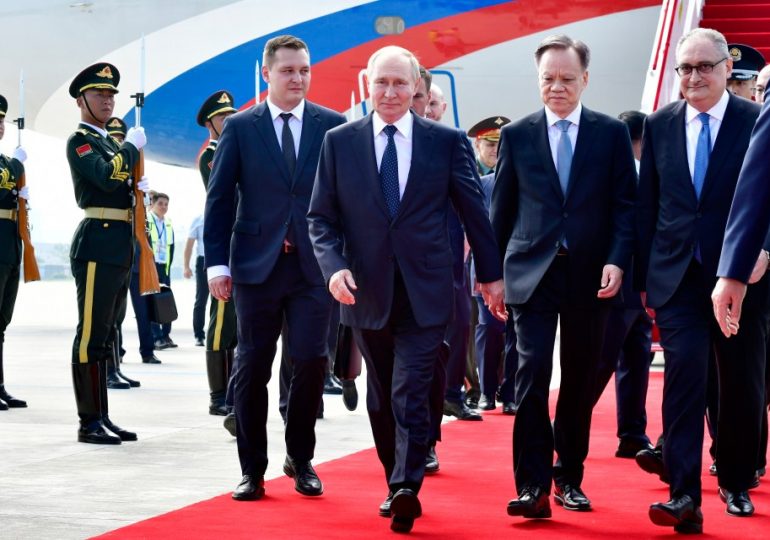 Putin has red carpet arrival in China ahead of ‘Axis of Evil’ meeting with Xi & Kim – while keeping up Ukraine slaughter