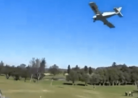 Horror moment plane CRASHES on golf course injuring two as golfers rush to help pilot instructor & student on board