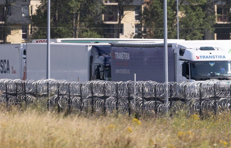 13 freezing UK-bound migrants found trapped in fridge lorry after driver heard them ‘screaming for help’ near Calais