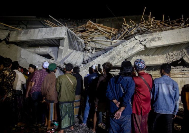 Frantic rescue as school collapses leaving at least one student dead and dozens trapped under the rubble in Indonesia