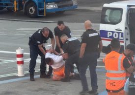 Moment drunk man is dragged off plane after trying to open door mid-air and brawling with other passengers