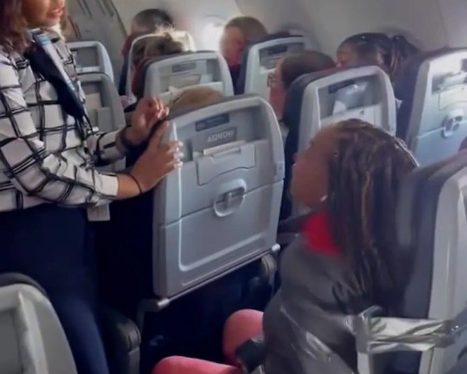 Shock moment ranting foul-mouthed passenger is strapped to seat with duct tape after ‘attacking crew’ on Vegas flight
