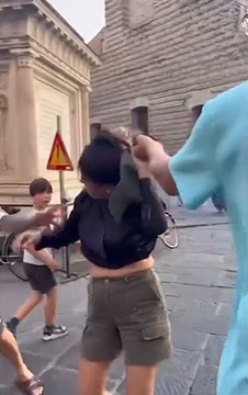 Shock moment ‘pregnant pickpocket’ is grabbed by her hair by husband who ‘spotted her stealing from his wife’