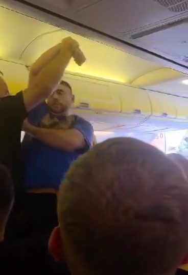 Dramatic moment armed cops drag boozy Brit stag do louts off Ryanair jet after terrorising passengers on holiday flight