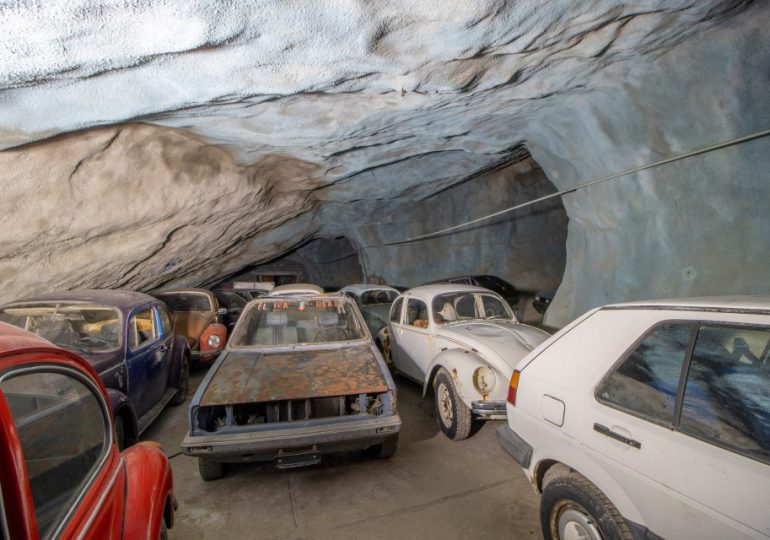 Mystery as dozens of vintage cars are found buried deep underground in derelict mine – with their keys still inside