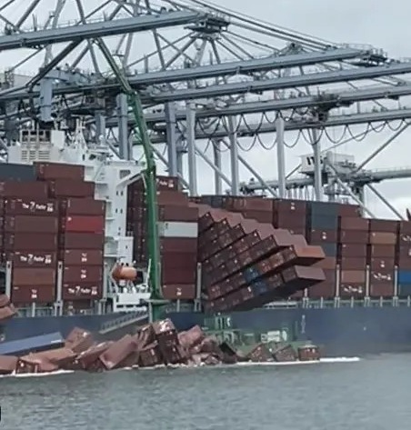 Shocking moment more than 60 shipping containers tumble off cargo ship & splash into sea like giant dominoes