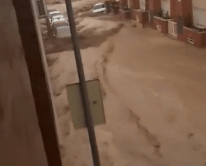 Spain hit by horror floods as deluge leaves drivers trapped and streets underwater… and red alert issued for MORE rain