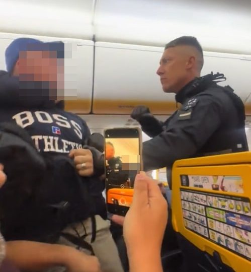 Shocking moment boozy Brit stag do yobs are dragged off Ryanair flight by armed cops after emergency landing