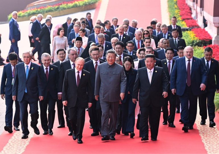 Putin, Xi and Kim stand side-by-side at China’s biggest ever army parade & warn world must choose between ‘peace or WAR’