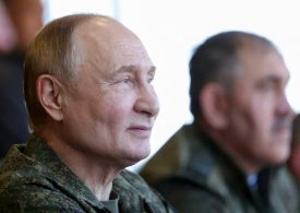 Putin dons military fatigues in war games 500 miles from the frontline in a show of strength to the West