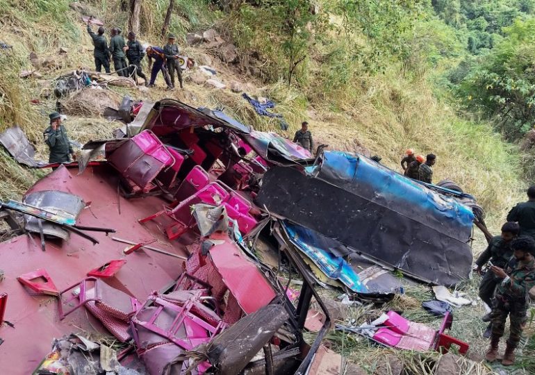 At least 15 dead as bus carrying tourists plunges 1,000ft after crashing through guardrails on Sri Lanka mountain road