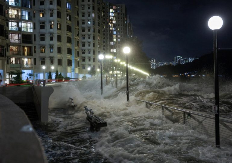 World’s BIGGEST super typhoon this year slams into Hong Kong & washes pair out to sea while lake bursts in Taiwan