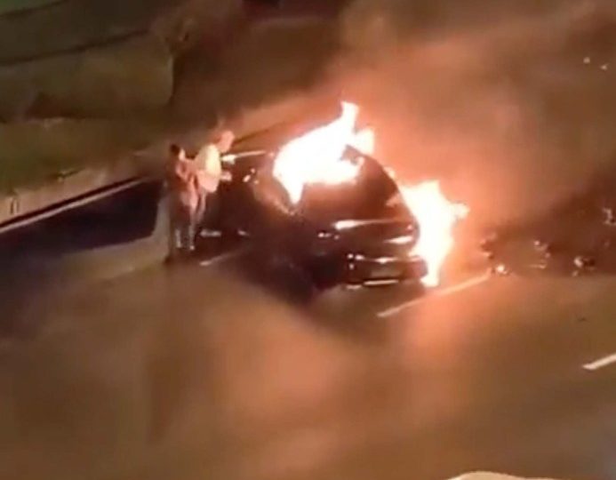Driver burns alive trapped in electric car as doors lock shut with bystanders unable to get him out after fiery crash