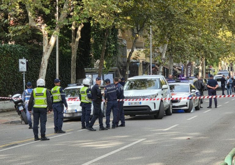 Judge is shot dead during court hearing by man on trial over property dispute while dad and son are left wounded