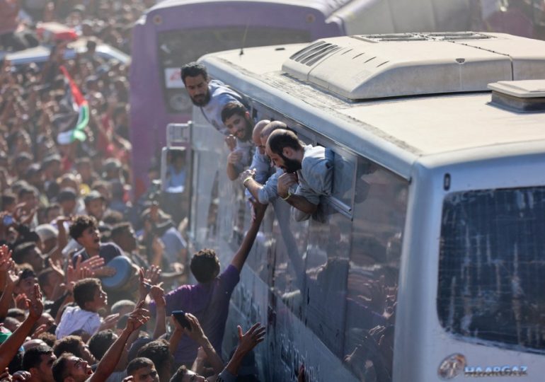 Moment buses carrying 2,000 freed Palestinian prisoners including murderers & terrorists arrive in Gaza