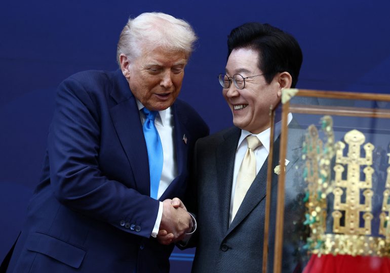 Watch as gleeful Trump is gifted a GOLDEN CROWN in South Korea – as rumours of surprise meeting with Kim Jong-un swirl