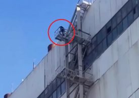 Dozens threaten mass suicide in Putin’s Russia over unpaid wages as strikers climb on roof & vow to throw themselves off