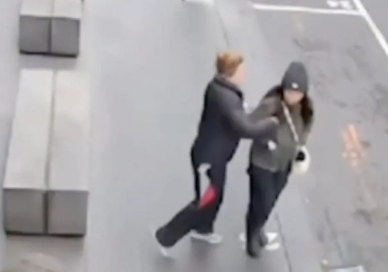Terrifying moment woman is stabbed by stranger while she walks to work as CCTV vid captures horrific unprovoked attack