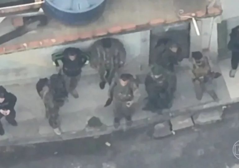 How battle of Rio unfolded as footage shows armed-to-the-teeth cartel commandos fleeing cops through bloodsoaked streets