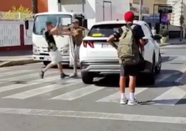 Shock moment Brit tourist gets into fist fight with local in Benidorm road rage after driving over zebra crossing