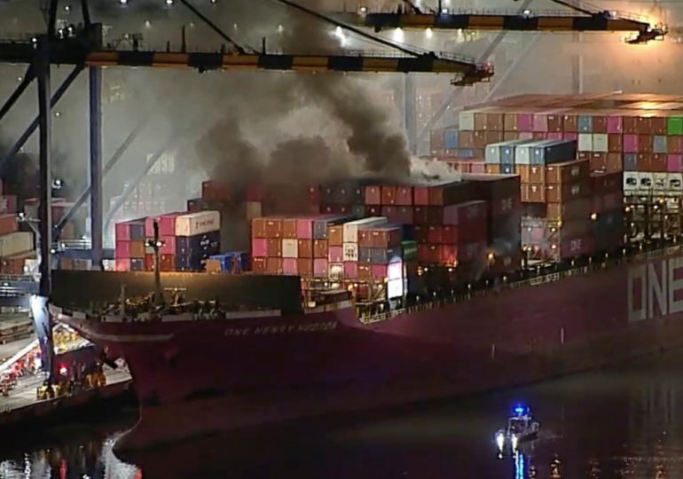 Huge inferno rips through cargo ship carrying hazardous material & sparks explosion at San Pedro port as crew evacuated