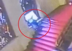 Humiliating moment politician stumbles and falls head first through priceless stained-glass window