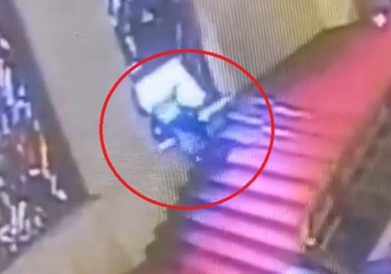 Humiliating moment politician stumbles and falls head first through priceless stained-glass window