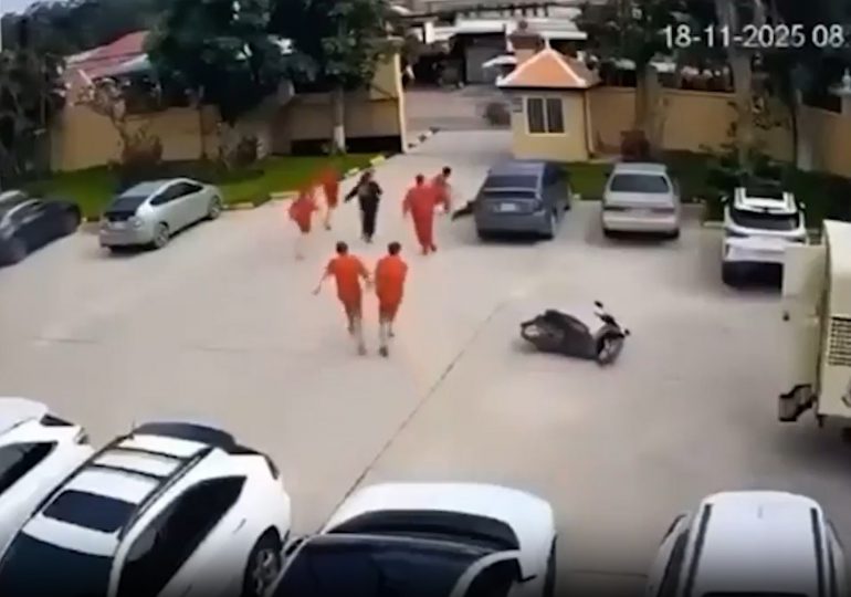 Shocking moment gangster’s moll hands jailed kingpin a gun outside court before he launches brazen daylight escape