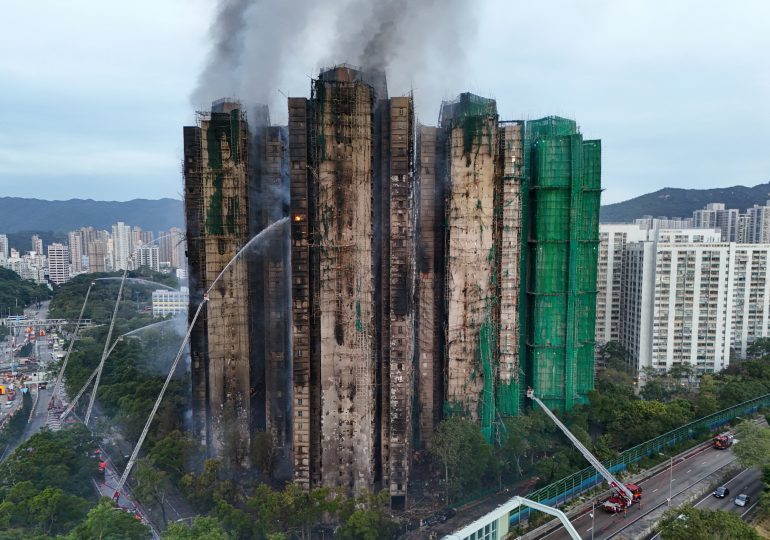 Death toll climbs to 55 in devastating Hong Kong tower block fire with hundreds more feared dead as three arrested